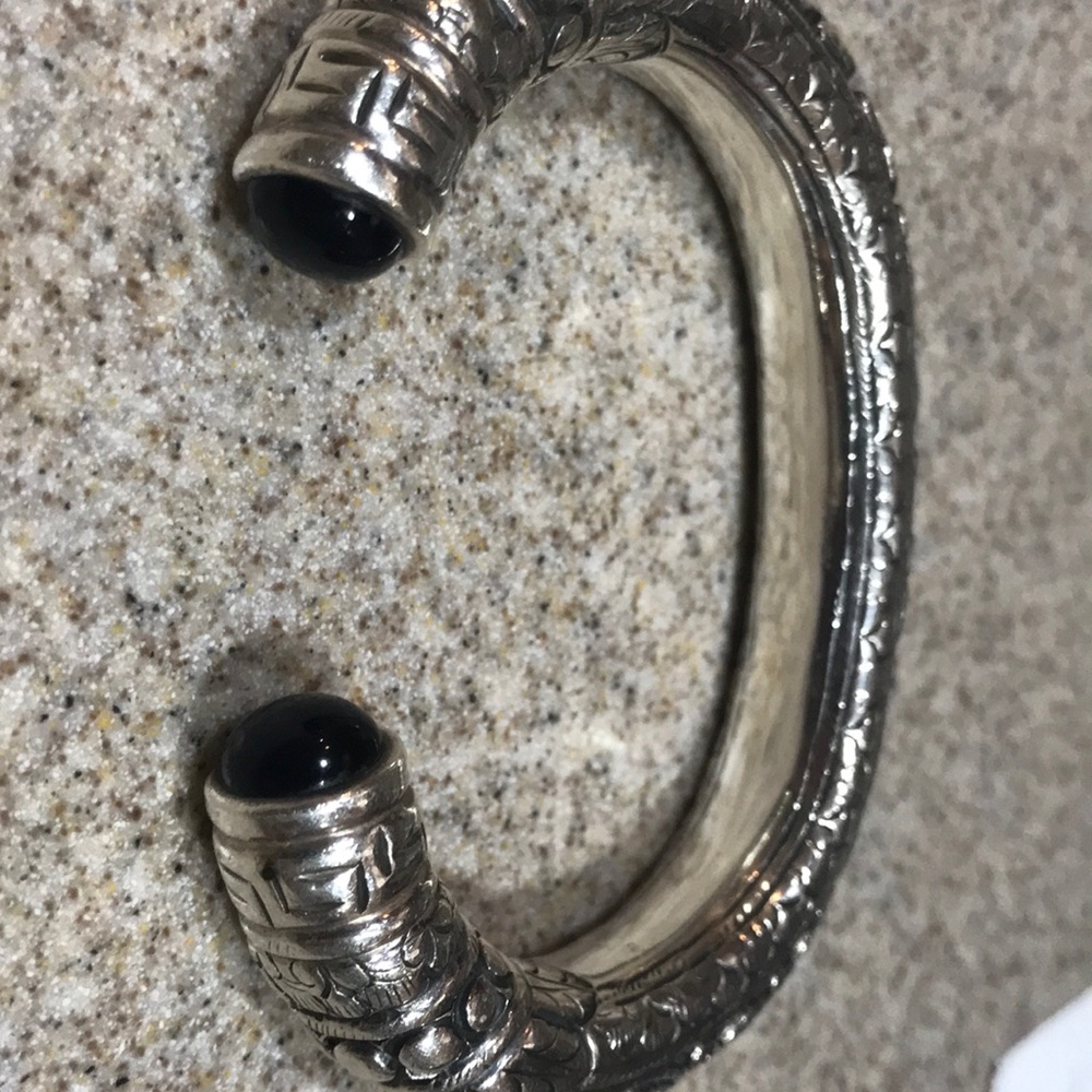Open-end sterling silver cuff bracelet.
